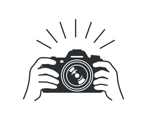 Hands holding camera with emanating light rays