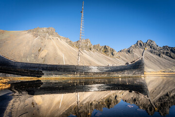 Vestrahorn rises 454 meters from the black sand coast, a basalt and gabbro formation shaped by glacial and marine erosion in Iceland&rsquo;s southeast.