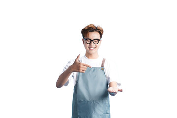 Smiling Chef Presenting: A cheerful chef, wearing an apron and glasses, smiles warmly as he...