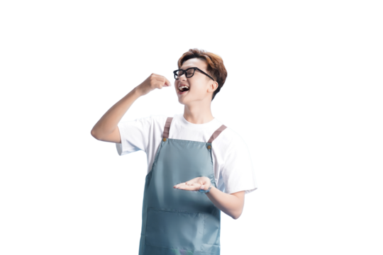 Culinary Delight: A smiling individual in an apron savoring a small portion of food with delight, perfectly capturing the essence of culinary pleasure.