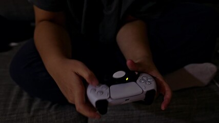 A close-up shot of a person's hands skillfully manipulating a controller during an intense gaming session.