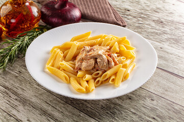 Pasta penne with chicken in cream sauce