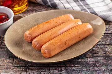 Boiled sausages with ketchup