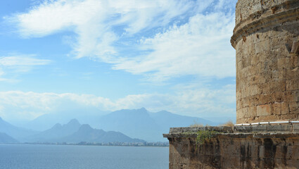 Fototapeta premium Beautiful mountain landscape that opens from Hydirlik Tower, a landmark of the old city in Antalya, Turkey.