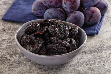 Black dry sweet prunes heap
