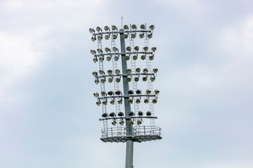 Photograph of numerous floodlight heads in the top section of a large lighting system at a sports stadium arena in Sydney in NSW, Australia.