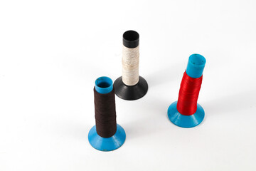 Colorful spools of thread offer a playful, vibrant crafting inspiration for sewing and creative projects that add a unique, handmade touch to designs