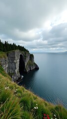 A serene scene with a large body of water next to a dramatic cliff