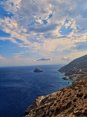 Late Afternoon Sun Illuminating Dry Hillsides and Blue Water