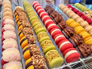 delicious dessert for tea colorful macaroons in the shop window. High quality photo