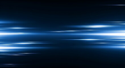 Abstract blue light streaks and trails moving fast across a dark background