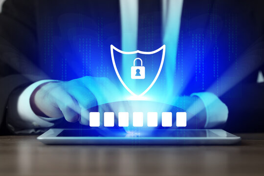 Password required. Cyber security and data protection concept. Man using tablet computer, closeup. Virtual screen with empty boxes and shield above device - Powered by Adobe
