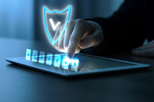 Man entering password on virtual screen above tablet computer, closeup. Cyber security and data protection concept