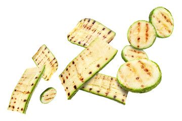 Grilled pieces of zucchini flying in air on white background