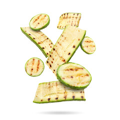 Grilled pieces of zucchini falling on white background