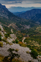Winding mountain road through dramatic canyon valley