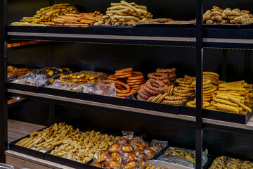 Shelves stacked with rings and twists of traditional bakery cookies