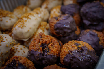 Assorted chocolate-dipped and glazed bite-sized pastries