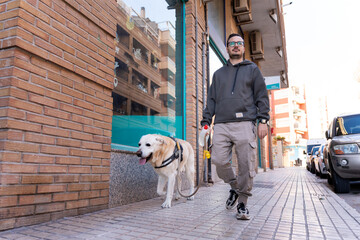 Man walking his dog on city street