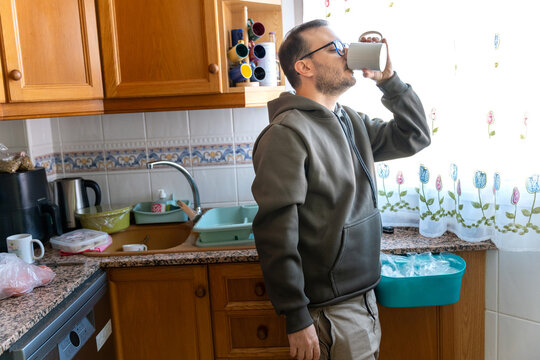 Freelance programmer enjoying coffee during morning routine