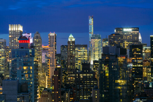 Fototapeta New York City, New York, United States. View of Manhattan city building lit up at twilight