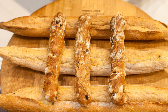 New York City, NY, USA  Baguettes of bread stacked on a display. 