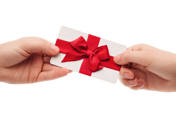 Two hands exchange a gift card with a red ribbon bow