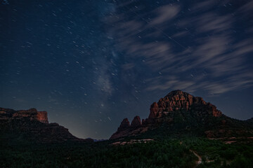 Sedona nightscape features the Milky Way and clouds over this iconic landscape