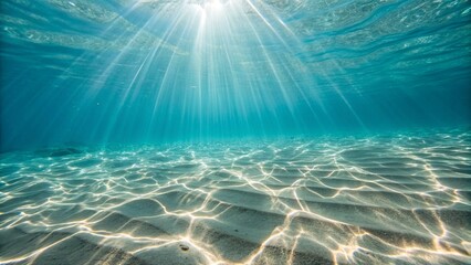 Photo of sunlight streams through crystalclear ocean water, creating a mesmerizing underwater scene with shimmering sand and a sense of tranquility and natural beauty