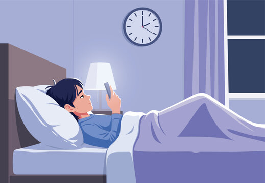 Young man using smartphone in bed at night, unable to sleep because of insomnia problem