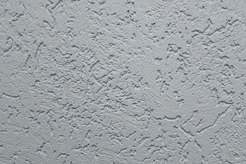 Textured gray stucco wall background with rough plaster pattern for design and decoration