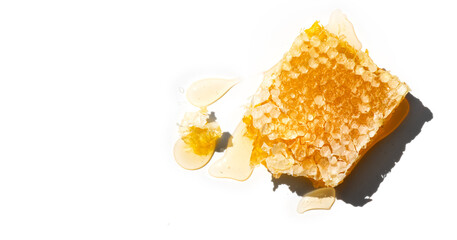 Honey in honeycombs dripping, pouring, isolated on white background. Honeycomb close-up. Healthy fresh organic liquid honey spill. 