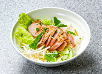 Vietnamese vermicelli bowl, a grilled pork neck and crisp symphony of fresh flavors and textures. Perfect for culinary websites and food blogs.