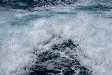 Ocean waves crashing with intensity and movement on a turbulent sea