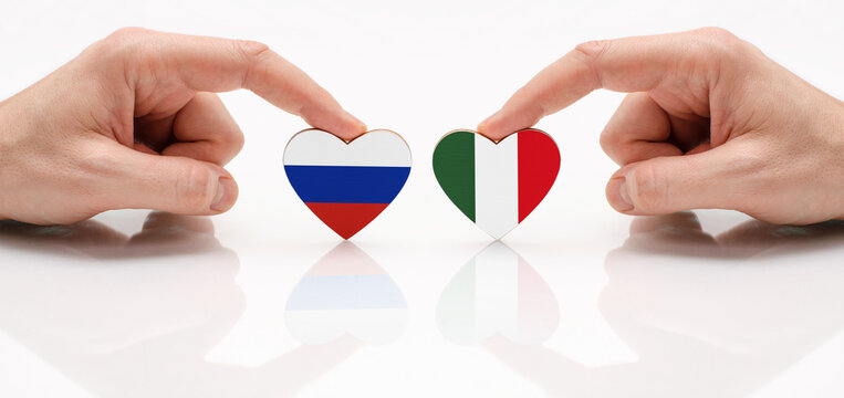 The flag of Russia and the Italy as a symbol of cooperation and respect. The concept of friendship and diplomatic relations between Russia and Italy.
