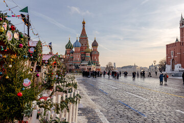 view of Moscow Red Square during winter, with Saint Basil Cathedral and festive Christmas decorations