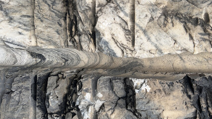 Closeup of gray and white natural marble texture background of wall at quarry