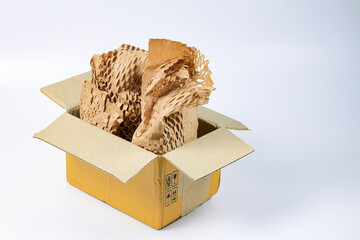 Item in Parcel box wrapped in eco-friendly wrapping paper, lightweight bubble wrap for protective packaging, Environmentally friendly Honeycomb paper hexagonal shape made of cardboard recycled paper.