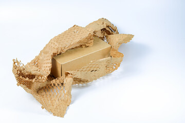 Parcel wrapped in eco-friendly wrapping paper, lightweight bubble wrap for protective packaging, Environmentally friendly Honeycomb paper hexagonal shape made of cardboard recycled craft paper.