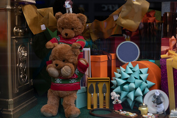 Cute teddy bears in Christmas sweaters at the supermarket