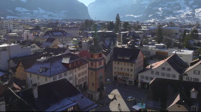 City of Altdorf in Canton Uri, Switzerland. Town Hall Square with historic houses on sunny Winter day. Aerial Drone Shot