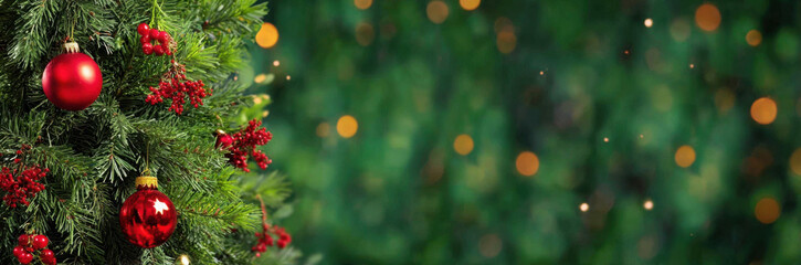 Fototapeta premium Close-up of a decorated Christmas tree with red baubles and ornaments on a blurred green background with bokeh lights, creating a festive holiday banner.