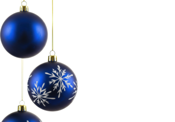 Four spherical deep sapphire blue christmas ornaments, two glossy, two with white snowflakes, hanging on golden strings on a transparent studio background, elegant holiday display.