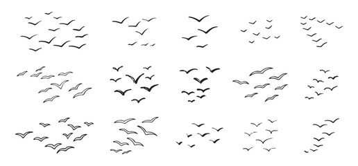 Birds flying line in the sky set. Ink grunge flock of birds afar brush hand drawn. markers and crayons