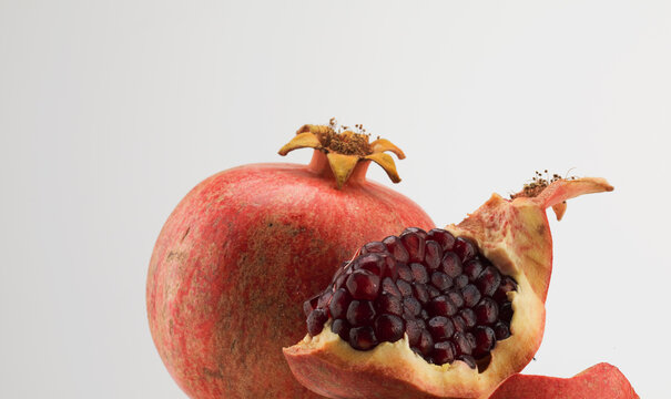 Still life of pomegranate cracked open