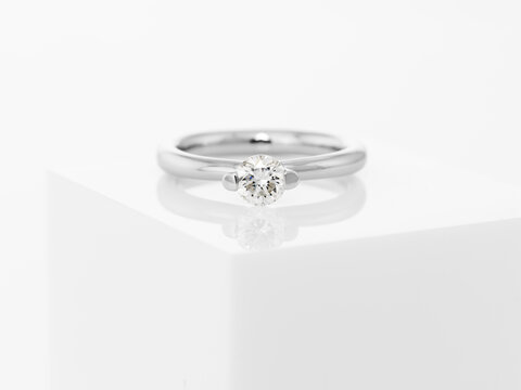 Still life of wedding rings on a white pedestal