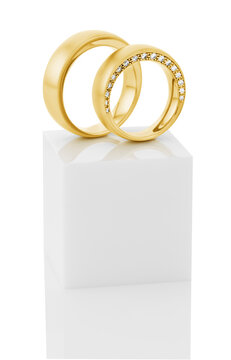 Still life of wedding rings on a white pedestal