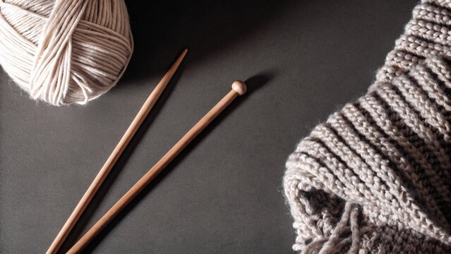 Knitting yarn on a dark background
Ball of yarn and knitting needles