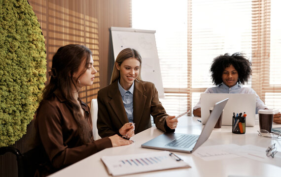 Diverse business team working together in modern office