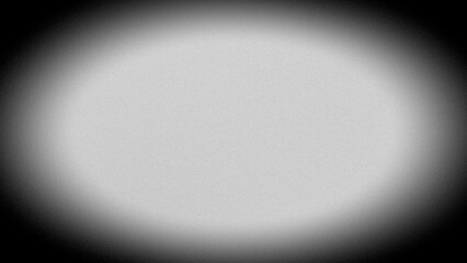 Abstract blurred grainy gradient background, gray spot in black frame.